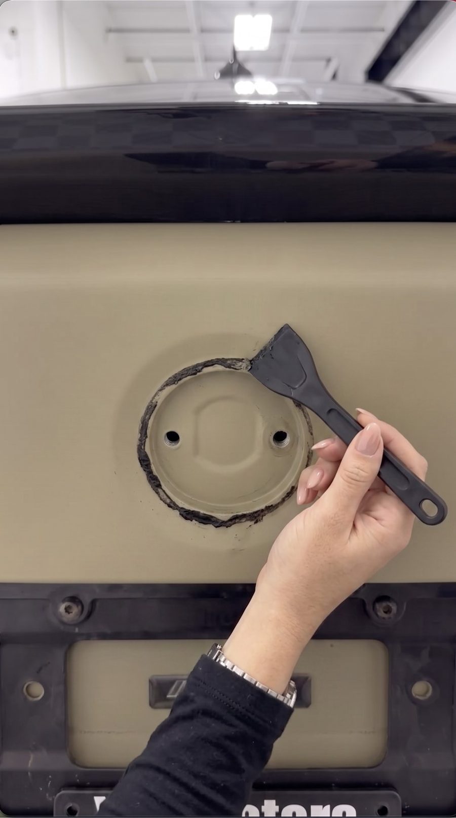 Cleaning the badge recess with adhesive remover
